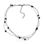 Twisted ruthenium white metal necklace with black beads for an elegant and modern look