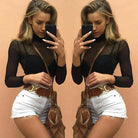 Trendy sheer crop top for women paired with high-waisted shorts and stylish accessories