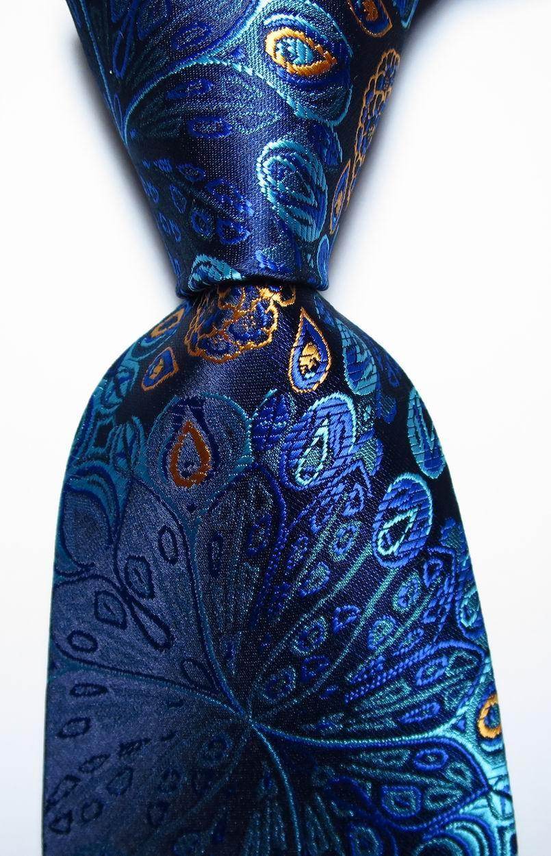 Silk paisley necktie in blue hues featuring intricate paisley patterns for stylish men's accessories