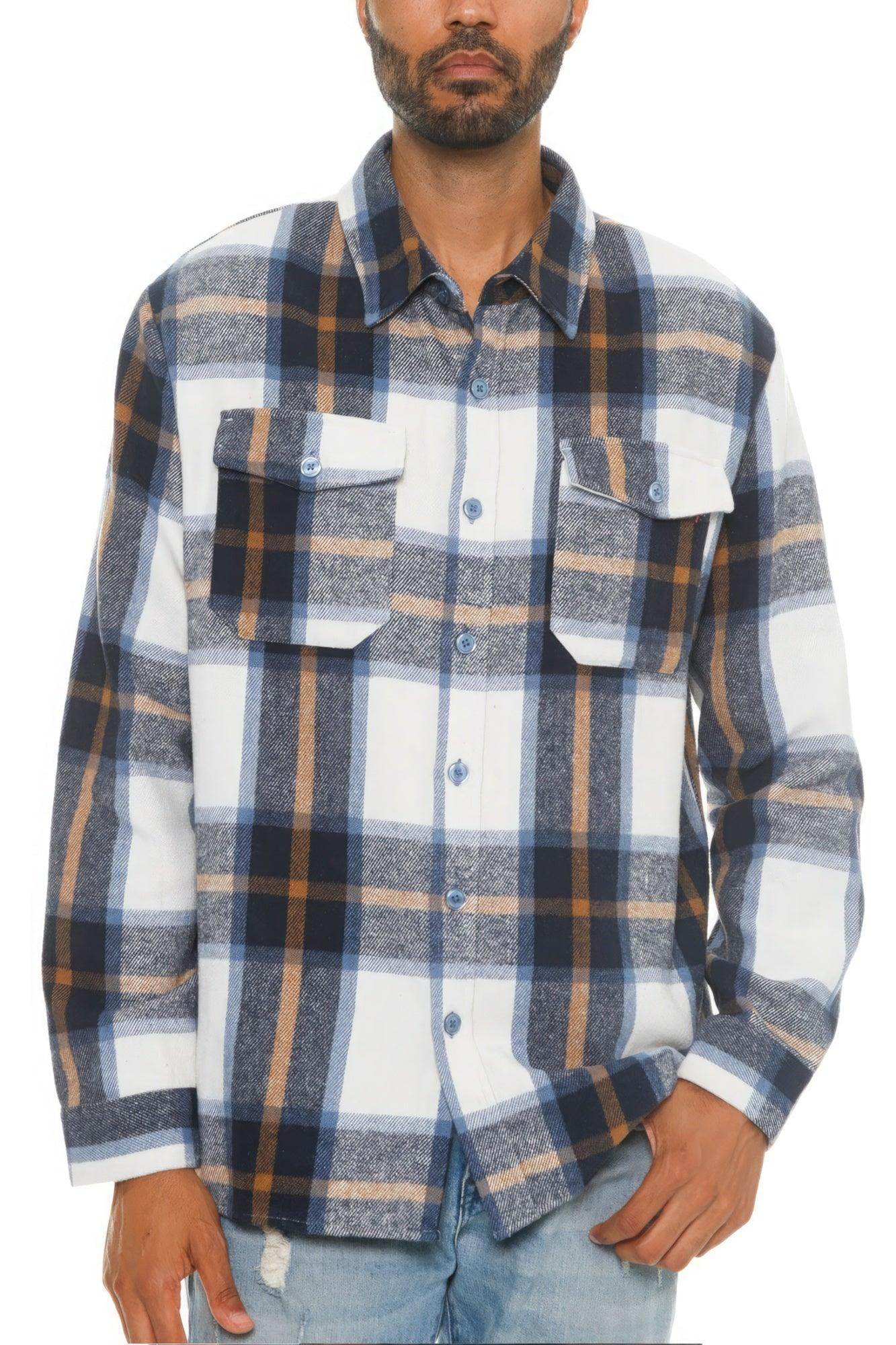 Model wearing a soft flannel shacket for men in a blue, brown, and white plaid pattern with chest pockets