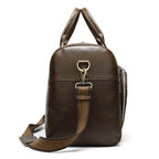 Soft leather travel duffel bag in brown with sturdy handles and adjustable strap for easy carrying