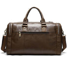 Soft leather travel duffel bag with multiple compartments and sturdy handles for easy carrying