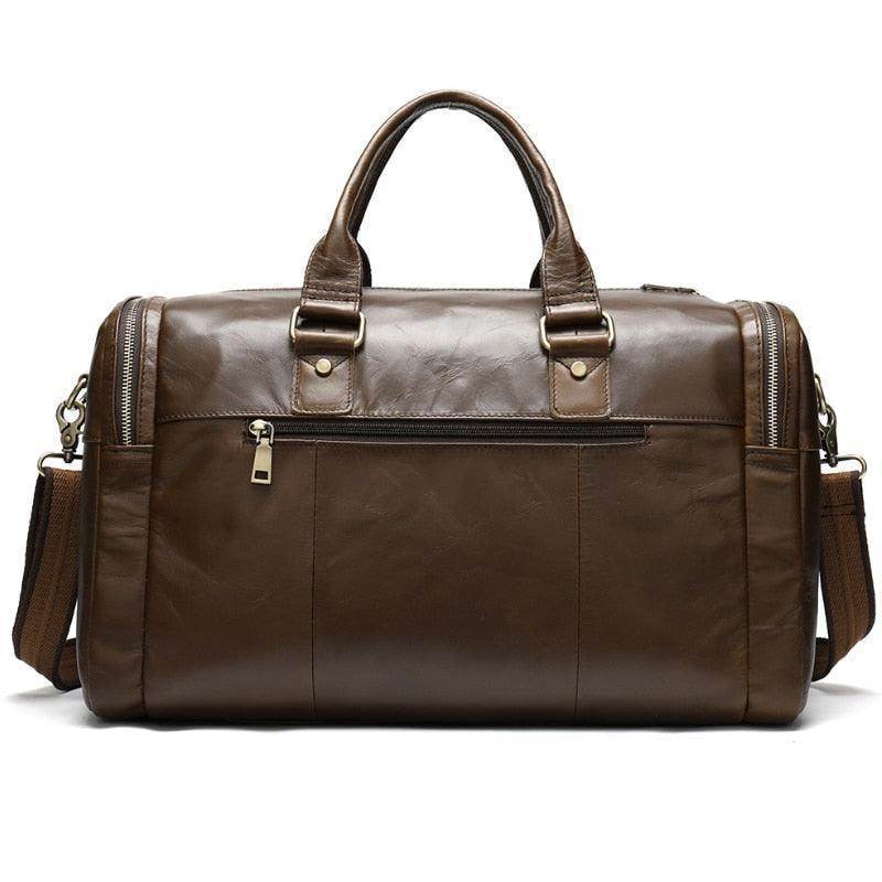 Soft leather travel duffel bag with multiple compartments and sturdy handles for easy carrying