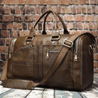 Soft leather travel duffel bag in brown with multiple pockets and adjustable strap for convenience