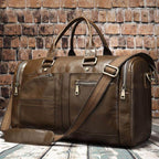 Soft leather travel duffel bag in brown with multiple pockets and adjustable strap for convenience