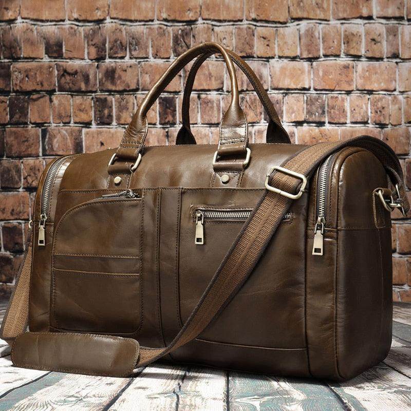 Soft leather travel duffel bag in brown with multiple pockets and adjustable strap for convenience