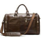Soft leather travel duffel bag with multiple pockets and detachable shoulder strap in brown