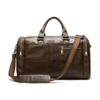 Soft leather travel duffel bag with multiple pockets and detachable shoulder strap in brown