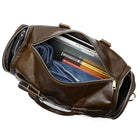 Soft leather travel duffel bag with spacious interior, perfect for weekend getaways and stylish travel.