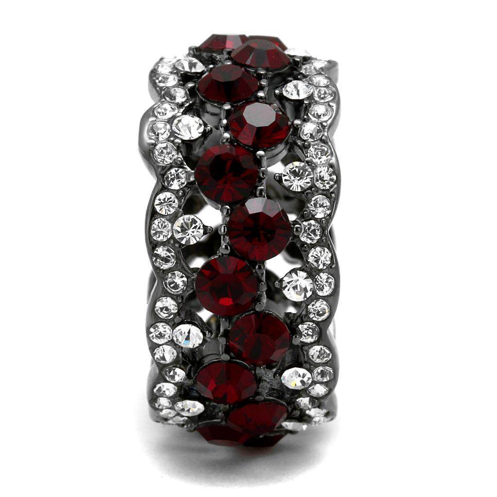 Stainless steel crystal ring with red and clear stones in a stylish wave design