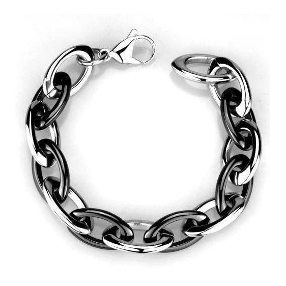 Chunky metal statement bracelets for vacation outfits with a sleek black and silver design