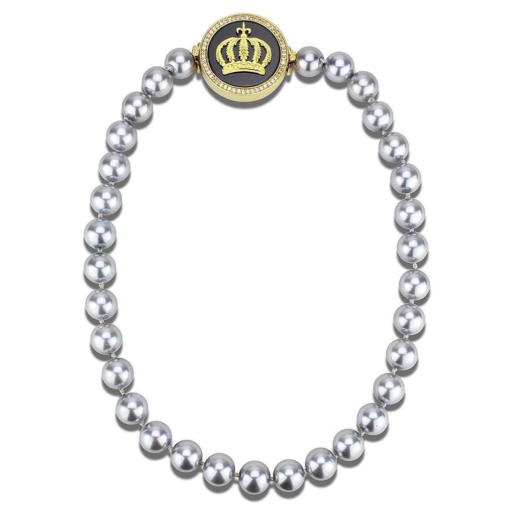 Statement gold crown necklace featuring a stylish crown pendant and silver pearls