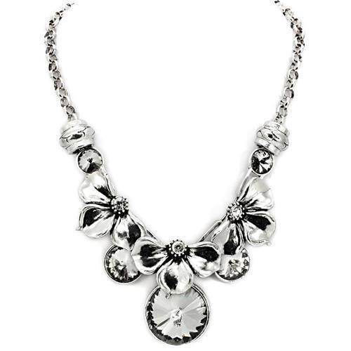 Elegant statement white metal necklace adorned with floral designs and sparkling crystals