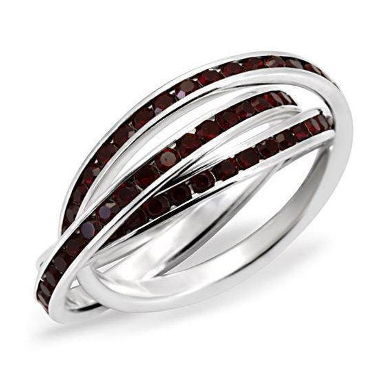 Sterling silver womens ring with intertwined design and red cubic zirconia accents