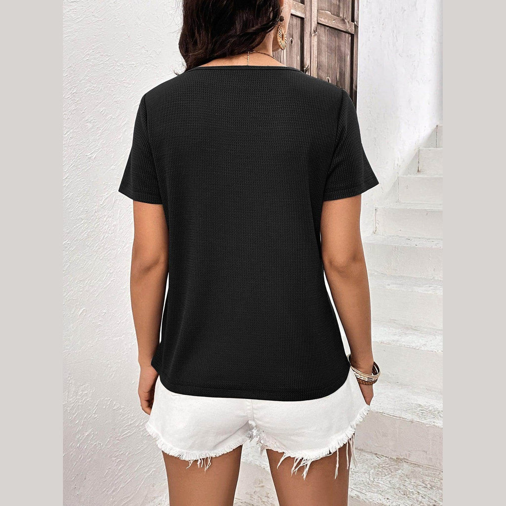 Back view of a black stylish lace trim shirt paired with white denim shorts