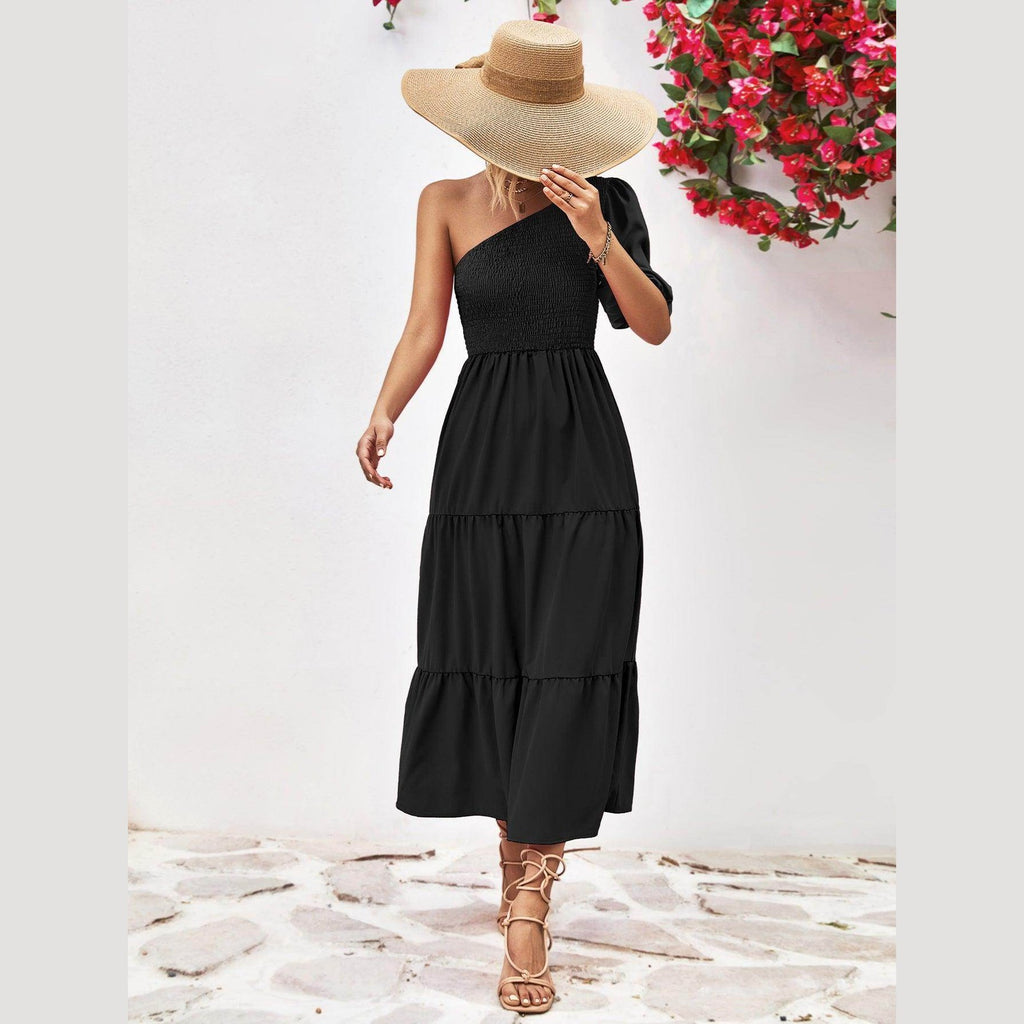 Trendsi stylish one-shoulder dress in black with a tiered design and a bow detail