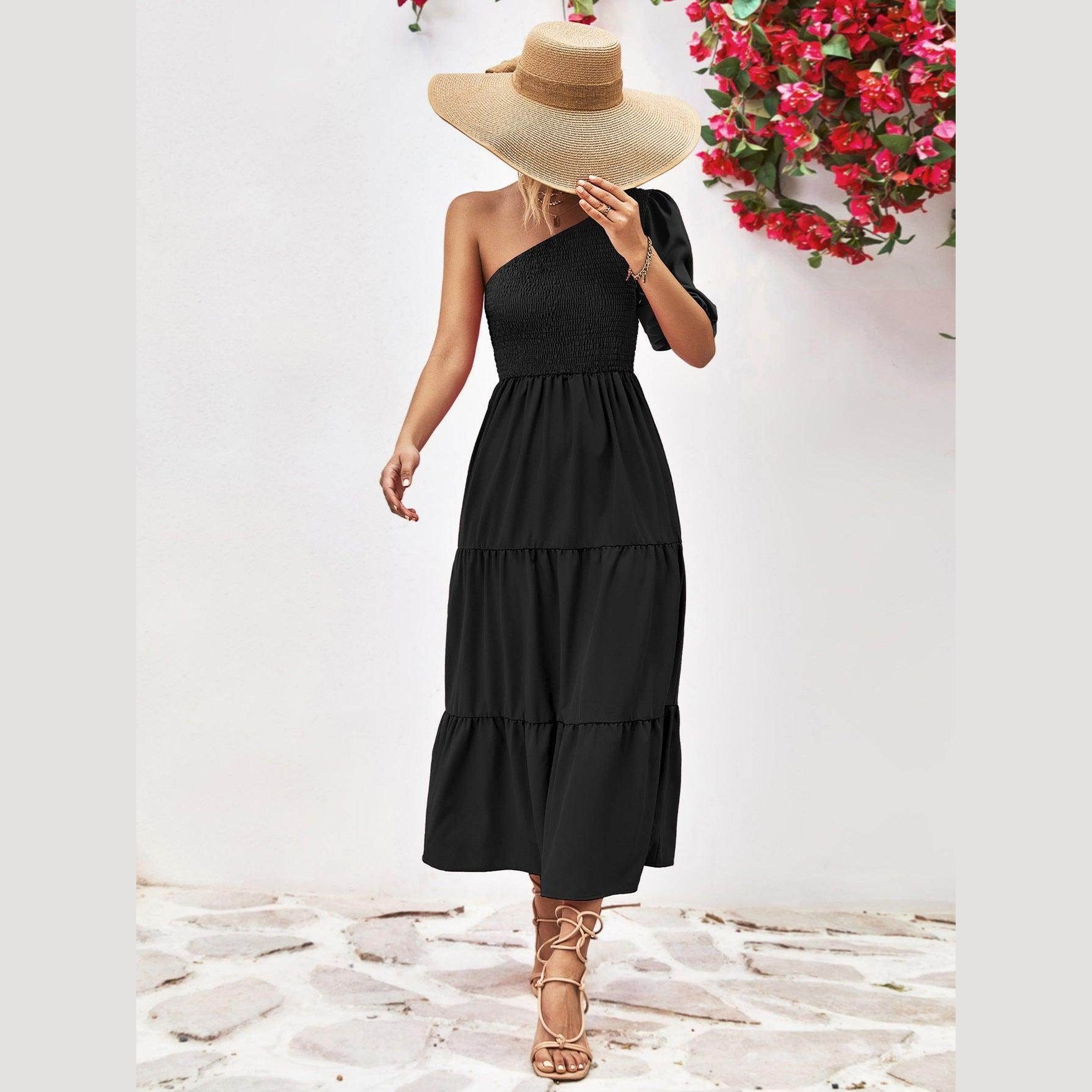 Trendsi stylish one-shoulder dress in black with a tiered design and a bow detail