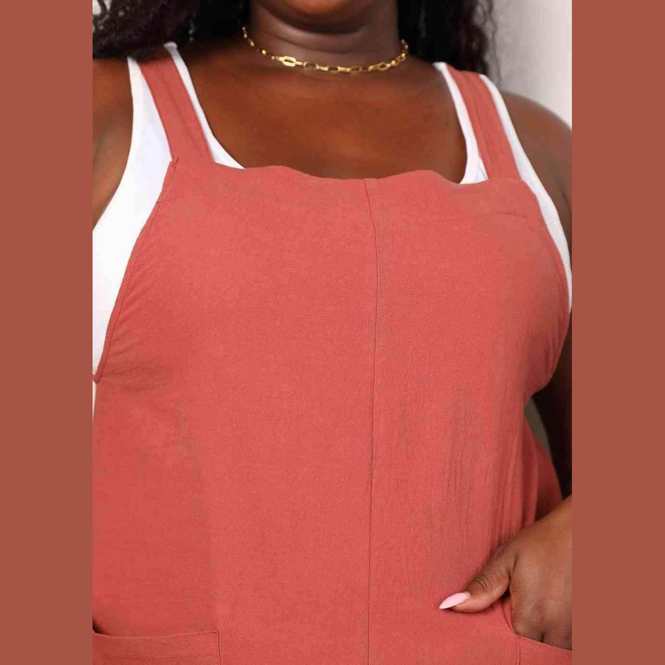 Trendsi stylish vacation overalls in coral color featuring a relaxed fit and adjustable straps