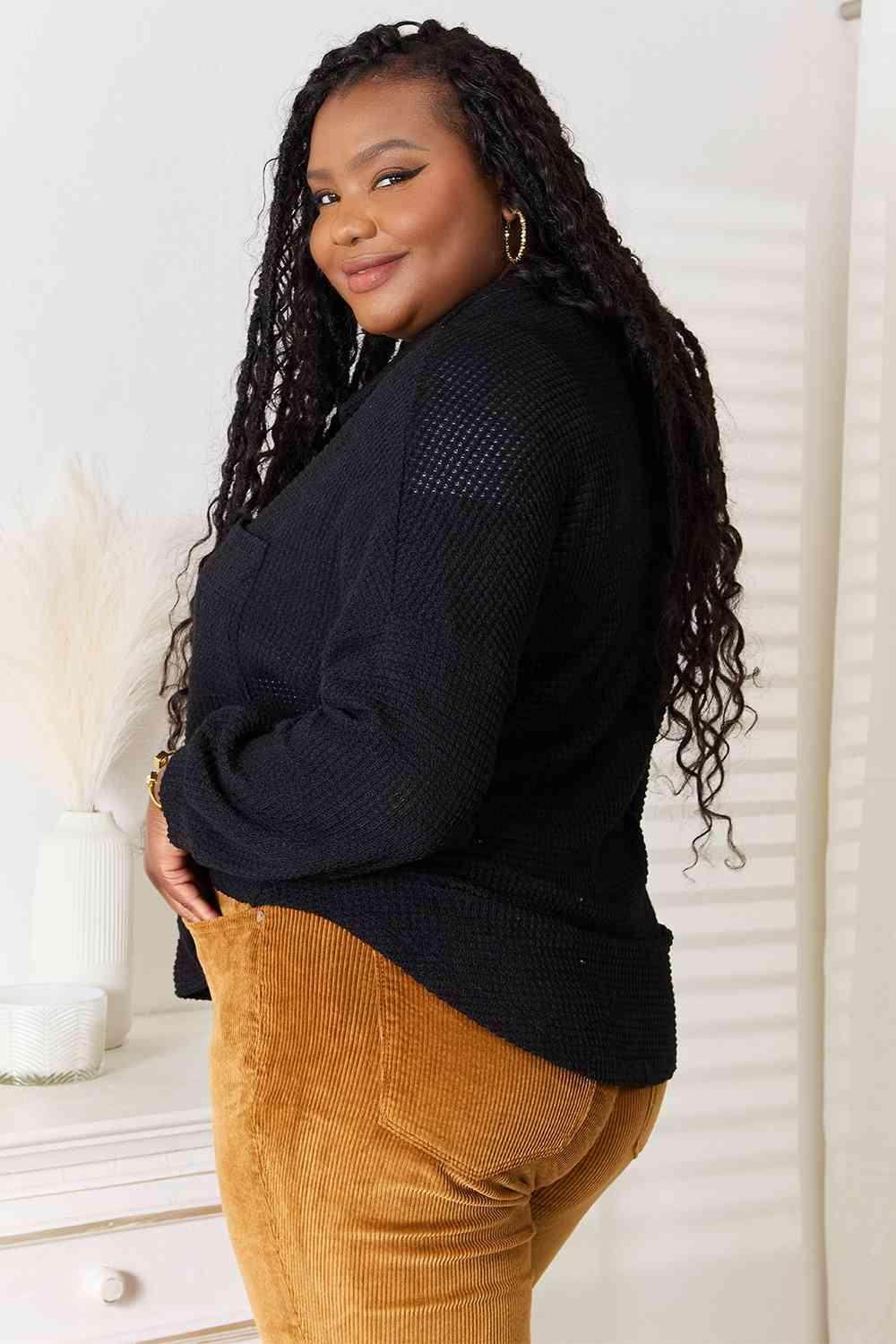Trendsi stylish vacation sweater in black featuring a relaxed fit and textured design for a chic look
