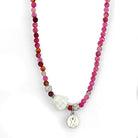 Colorful synthetic gemstone statement necklace featuring a Buddha charm and an awareness pendant