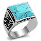 Men's synthetic turquoise jewelry ring with intricate black designs and a polished silver band
