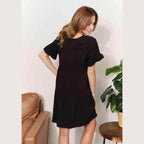 Trendsi Women's Tiered Summer Dress in Black, featuring short sleeves and a relaxed fit
