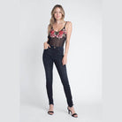 Ivory Felix transparent floral blouse in black with rose design, paired with dark skinny jeans