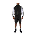 Trendy mens summer outfit featuring a black and white 2PC track set with zip-up jacket and shorts