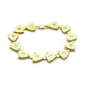 Triangle charm gold bracelet featuring shiny triangular charms with sparkling accents