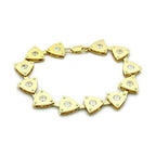 Triangle charm gold bracelet featuring shiny triangular charms with sparkling accents