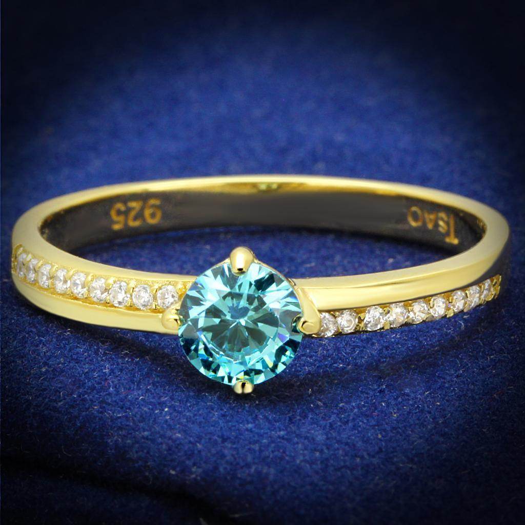 Gold 925 sterling silver ring featuring a turquoise gemstone and sparkling accents for elegant style