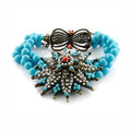 Turquoise and copper statement bracelet featuring intricate design and vibrant colors for a bold look