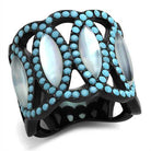 Stunning turquoise inlay statement ring for women with intricate black band and iridescent accents