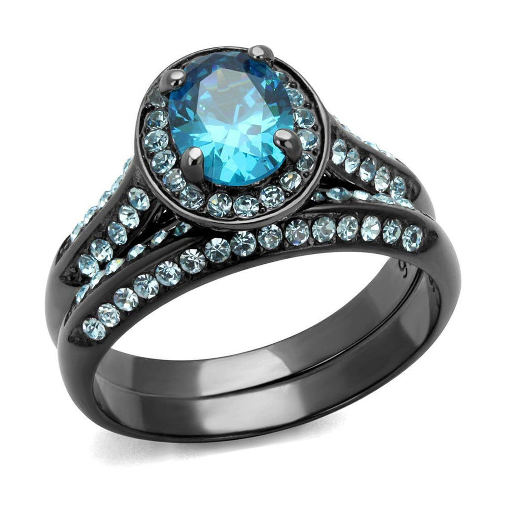 Unique black engagement ring featuring a blue oval center stone and sparkling accents