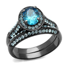 Unique black engagement ring featuring a blue oval center stone and sparkling accents