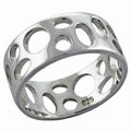 Unique cut out silver band for women featuring circular designs in polished metal finish