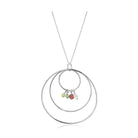 Unique vacation jewelry for her featuring a silver hoop necklace with colorful stone accents