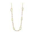Unique vacation necklace for women featuring gold links and coral beads for a stylish beach look