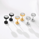 Stylish men's earrings in black, gold, and silver featuring sparkling diamonds, perfect vacation jewelry for men