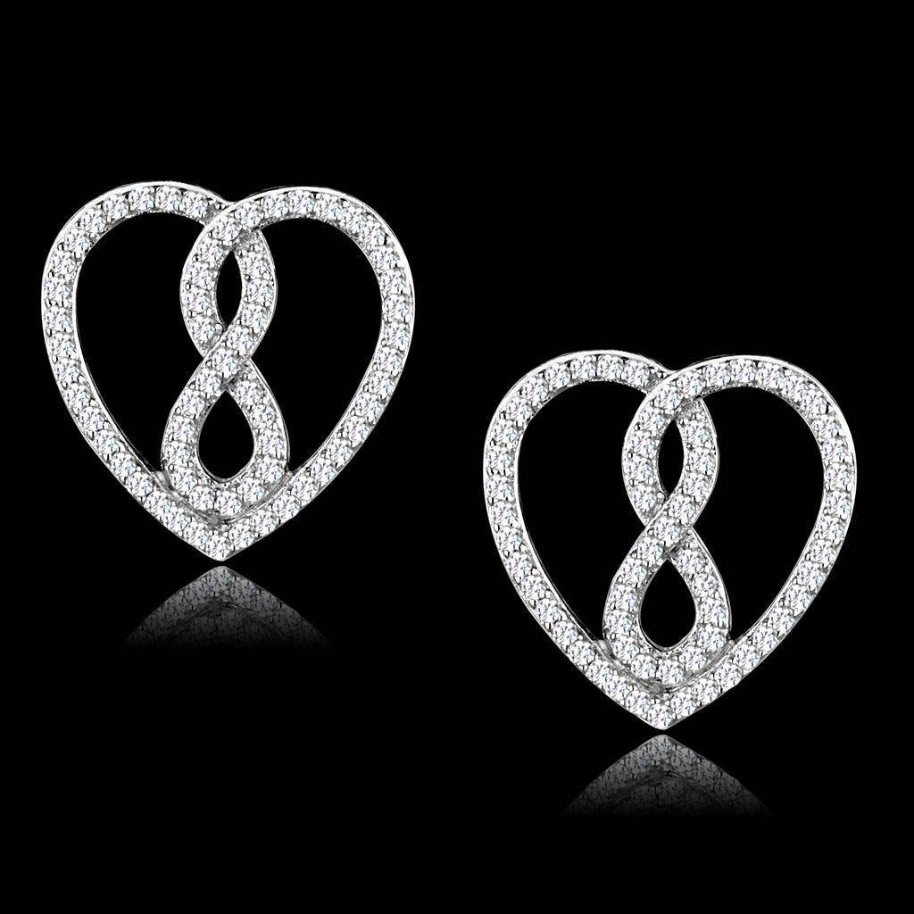 Elegant silver heart-shaped earrings with sparkling stones, perfect as vacation jewelry for women