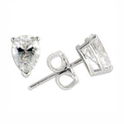 Vacation jewelry for women featuring elegant pear-shaped diamond stud earrings in silver