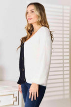 Stylish women's vacation style cardigan in black and white with chic button details