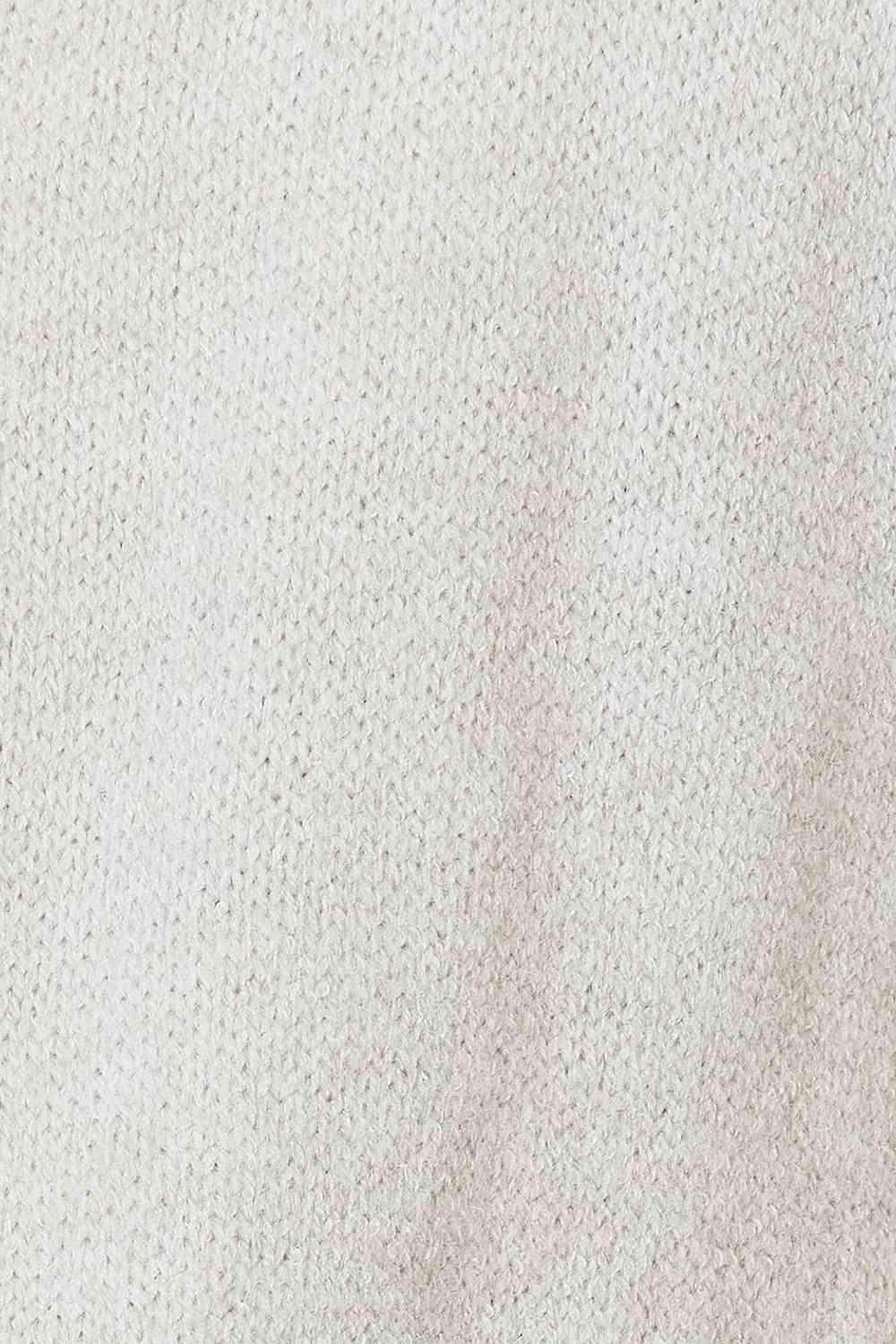 Lightweight vacation style cardigan in soft cream knit fabric for effortless layering