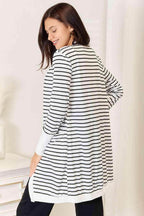 Stylish women's vacation style cardigan featuring a black and white striped design