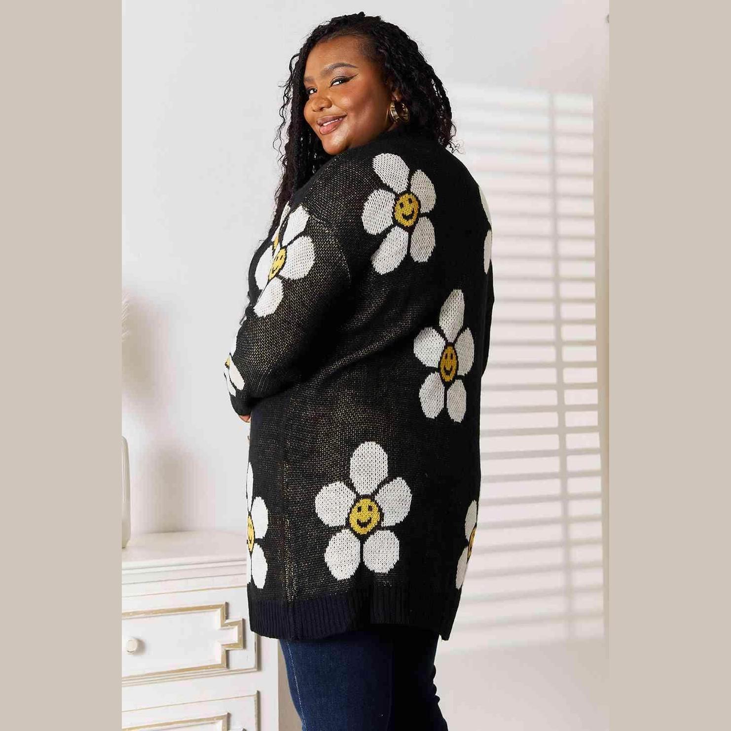 Trendsi women's vacation style floral cardigan in black with cheerful daisy designs on the back
