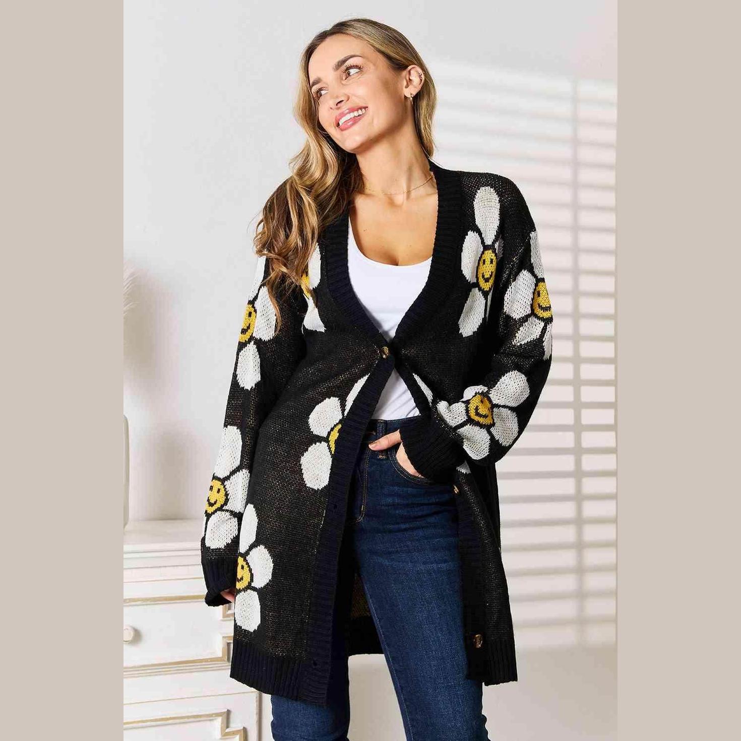 Trendsi vacation style floral cardigan featuring smiley daisies on a black background for cheerful outfits