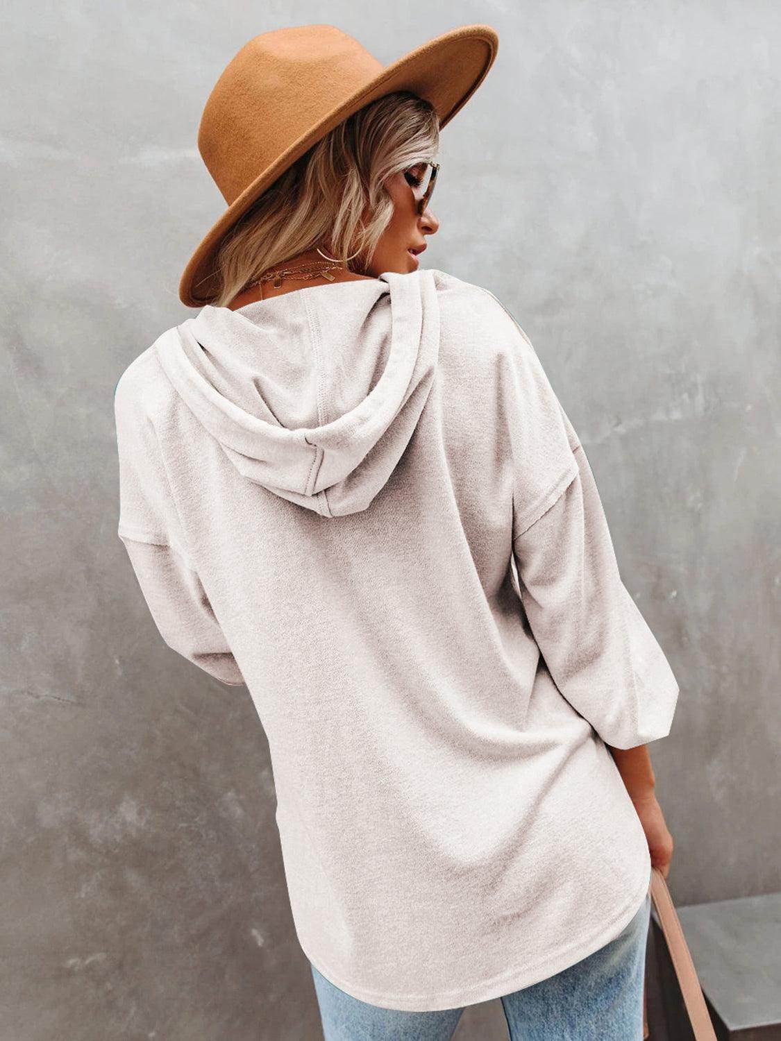 Women's vacation style hoodie in soft beige with a relaxed fit and attached hood
