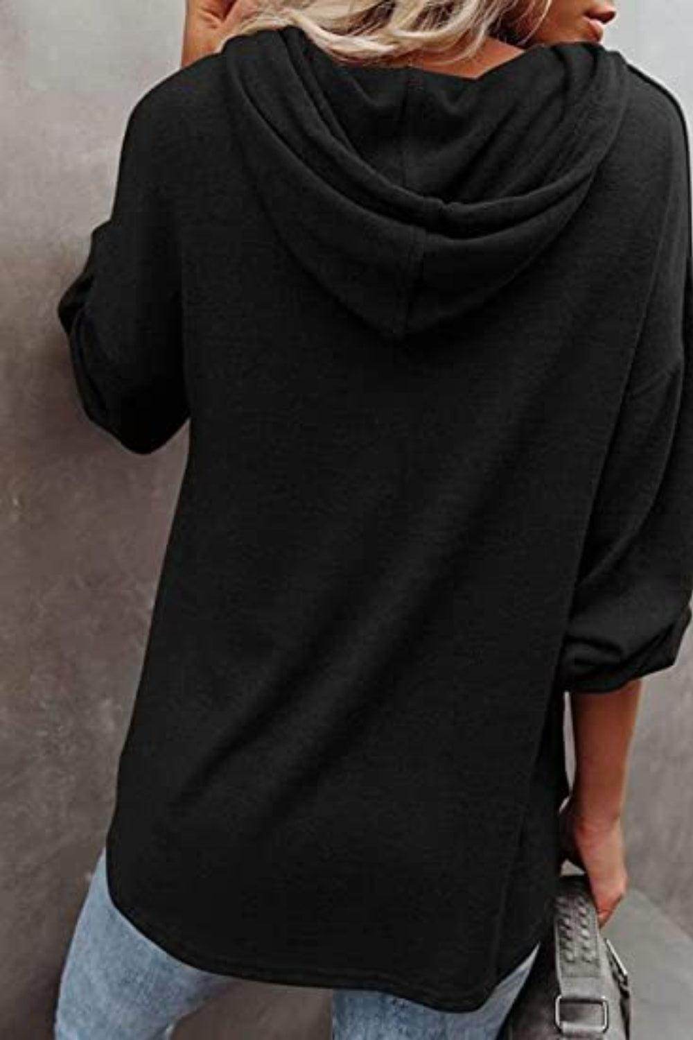 Black women's vacation style hoodie with a relaxed fit and back pleat for comfortable wear