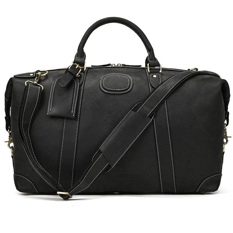 Vacation style leather bag with adjustable shoulder strap and sturdy handles in classic black