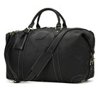Stylish black vacation style leather bag with sturdy handles and detachable shoulder strap